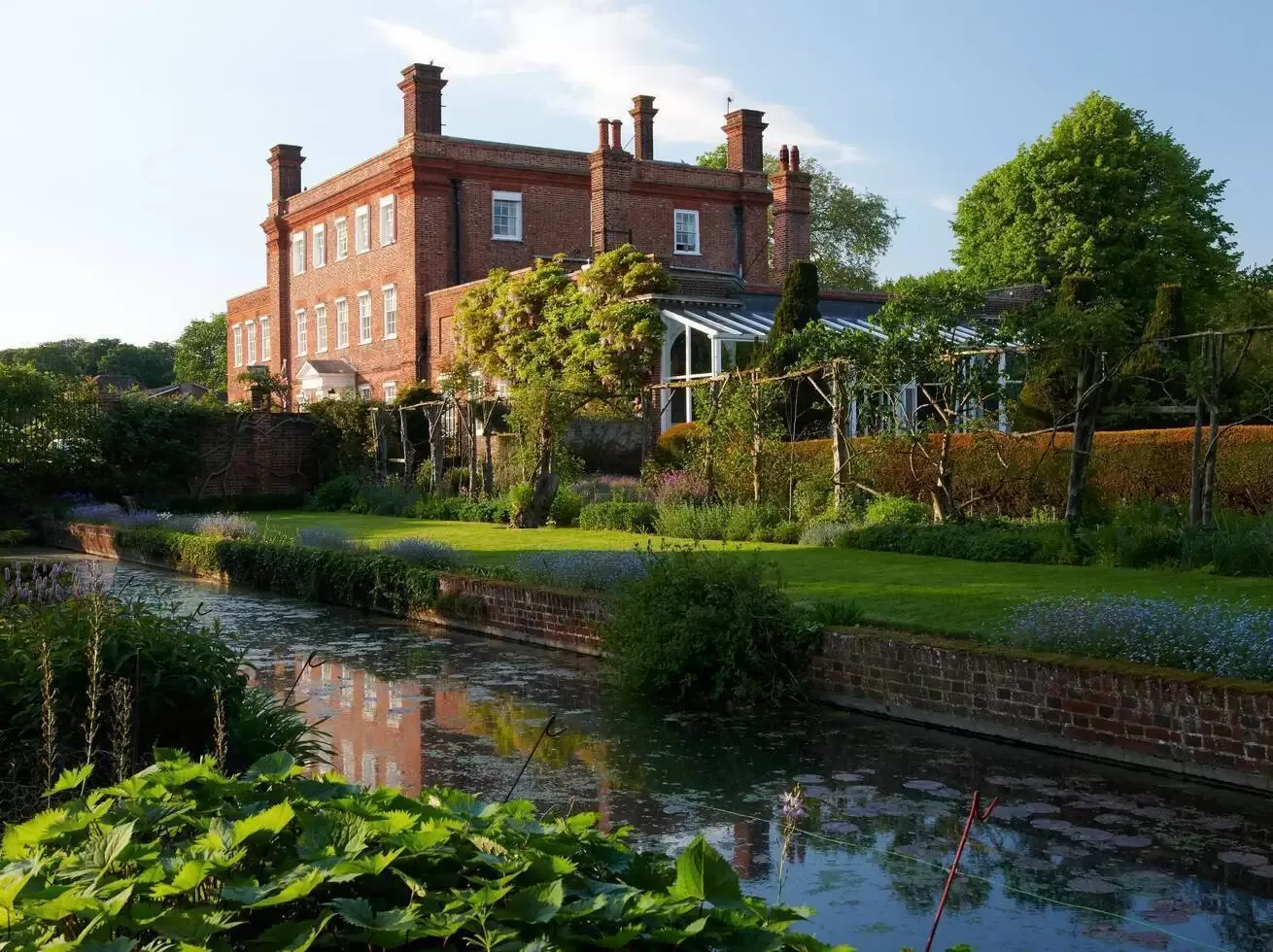 The red-brick manor at Champneys Henlow beside the river
